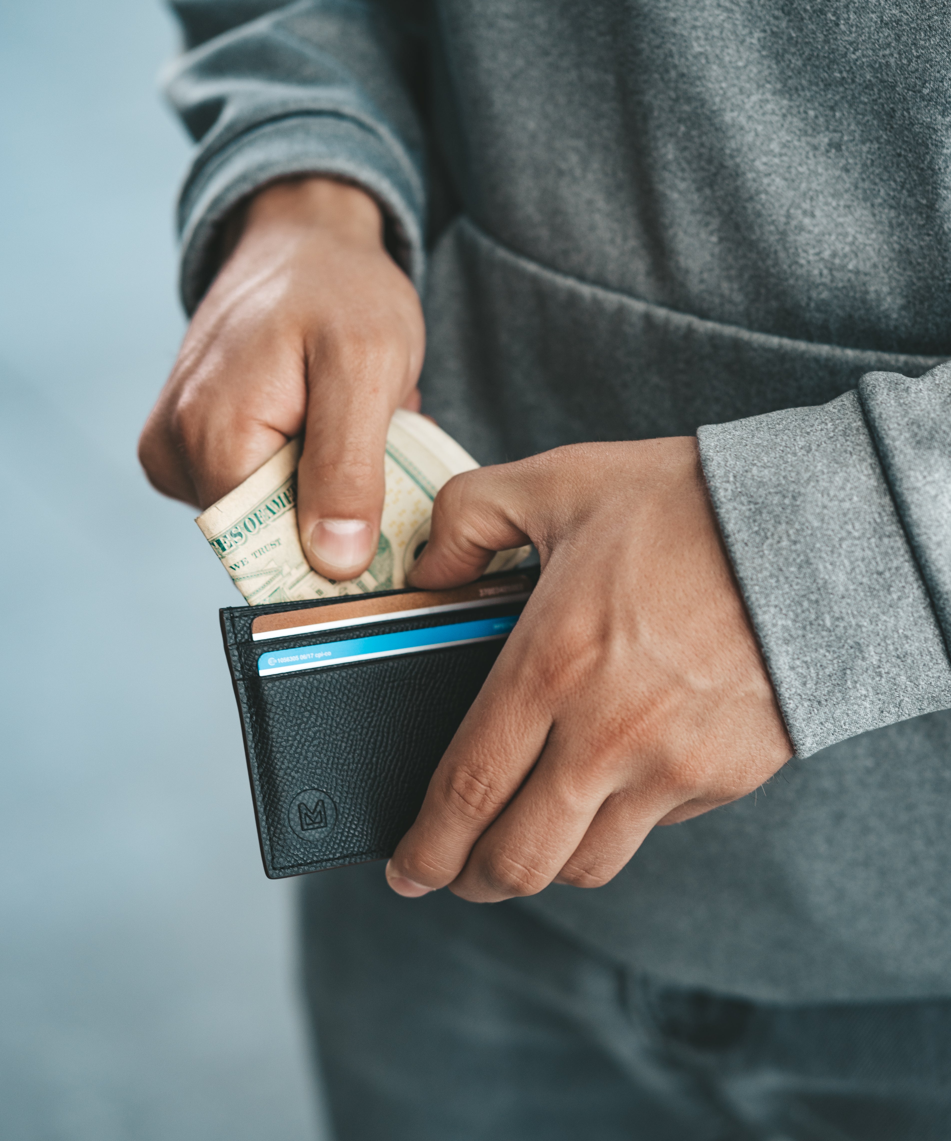 Leather card holder being held 2